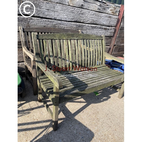 411 - A pair of weathered hardwood garden benches