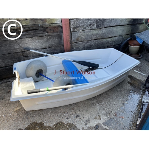 418 - A white plastic rowing boat with transit wheel