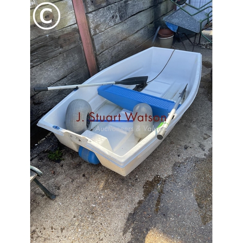 418 - A white plastic rowing boat with transit wheel