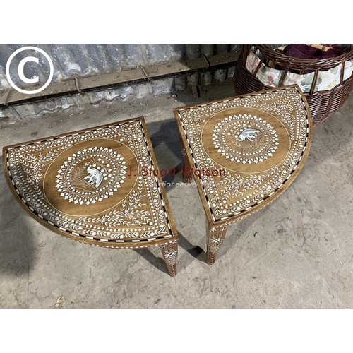 48 - A pair of inlaid elephant side tables together with a basket and rugs