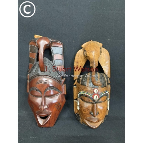 596 - 2 African masks, height 38cms