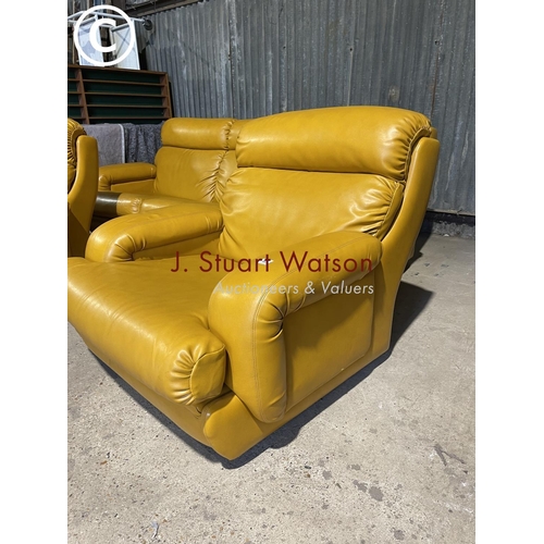 63 - A mid 20th century mustard coloured vinyl three piece lounge suite