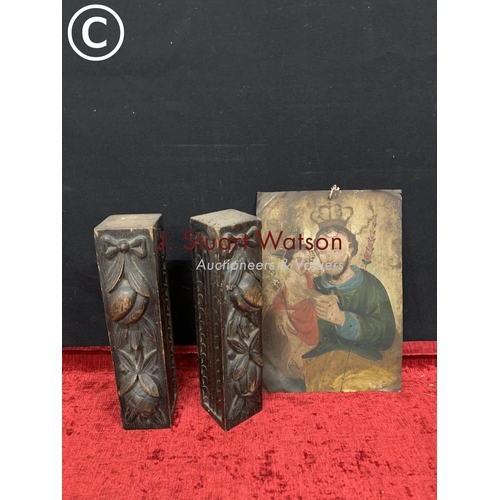 685 - 2 pieces of carved wood, each 33cms long and religious metal picture