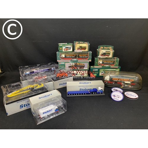 699 - 14 boxed Stobart Vehicles, Stobart lorry and mini under dome and coasters