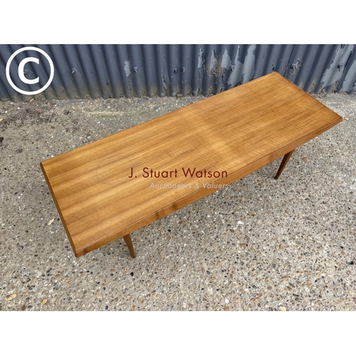 7 - A mid century teak plank top coffee table by Gordon Russell