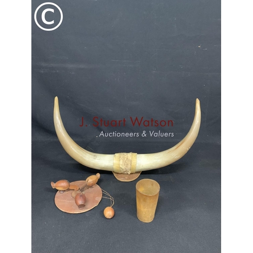 721 - Pair cow horns, beaker and wooden bird toy