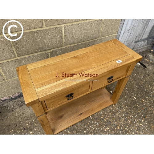 75 - A light oak two drawer hall table