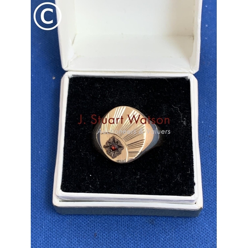 867 - 9ct Gold Gents signet ring size N, set with single red stone, 4.2 gms