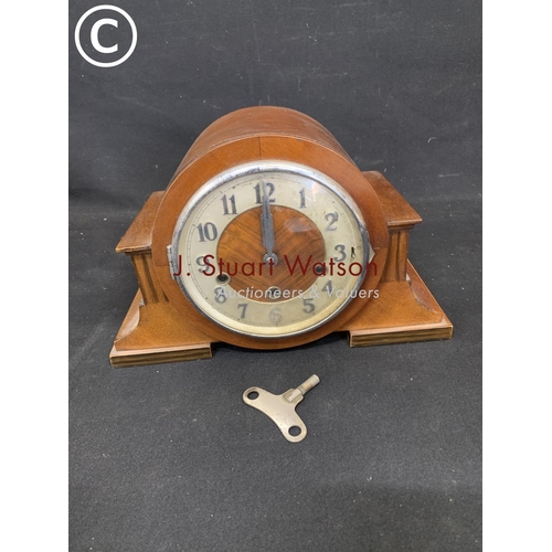 909 - Art Deco mahogany striking match clock with key and pendulum