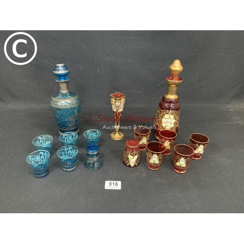 918 - Two overlaid glass liqueur sets and specimen vase