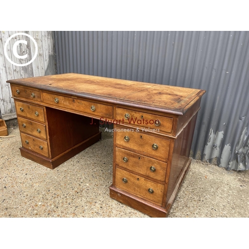 96 - A victorian mahogany pedestal desk with a gold leather top 152x79x77