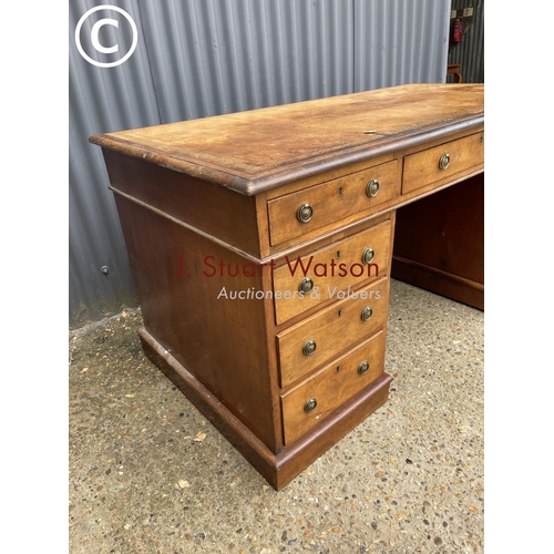 96 - A victorian mahogany pedestal desk with a gold leather top 152x79x77