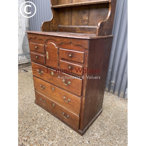 97 - An early oak dresser base (cut to two section) with later oak platerack top