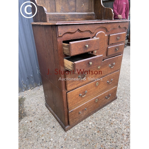 97 - An early oak dresser base (cut to two section) with later oak platerack top