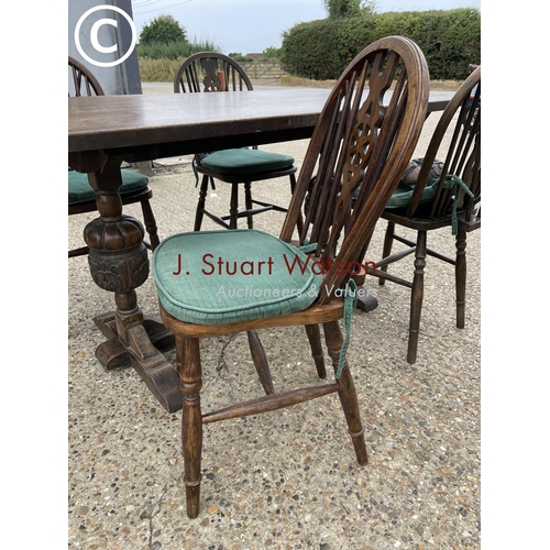 98 - An oak refectory style table together with four wheelback chairs