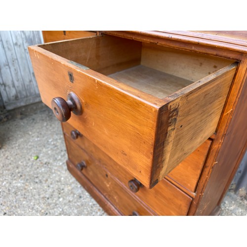 111 - A victorian pitch pine chest of five drawers