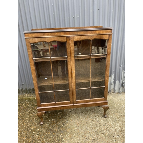 10 - A glazed mahogany two door bookcase