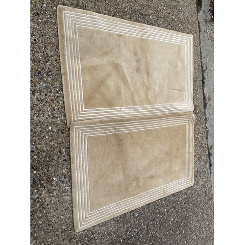 100 - A pair of modern beige pattern rugs 160x95