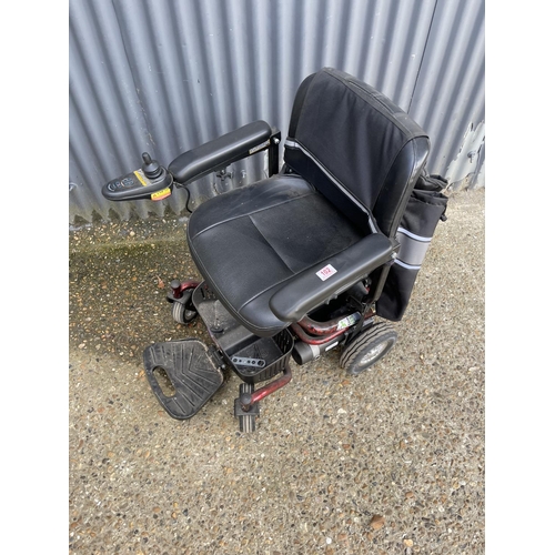 102 - A ROMA electric powered wheelchair in full working order with charger