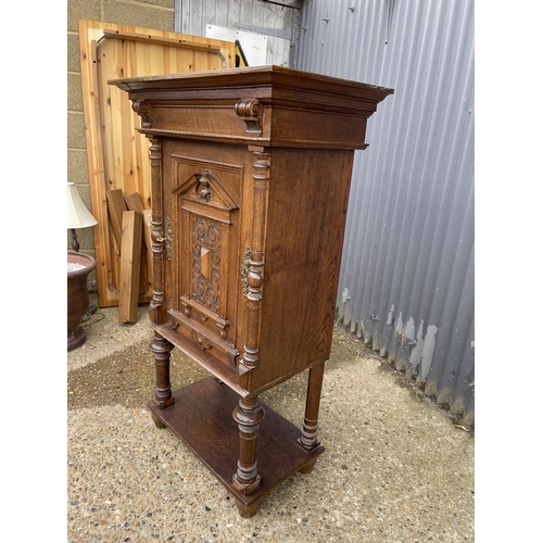 11 - A continental oak cupboard fitted with shelves to interior  80x45 x 134