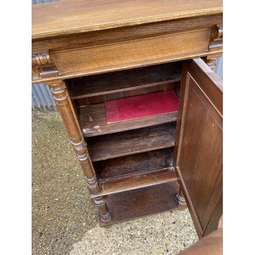 11 - A continental oak cupboard fitted with shelves to interior  80x45 x 134