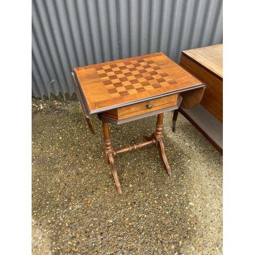 12 - A mid century teak trolley, a chequered top games table and a balloon back chair