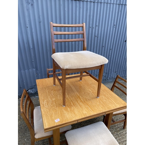 128 - A danish style teak drawer leaf table with five chairs stamped A&FH