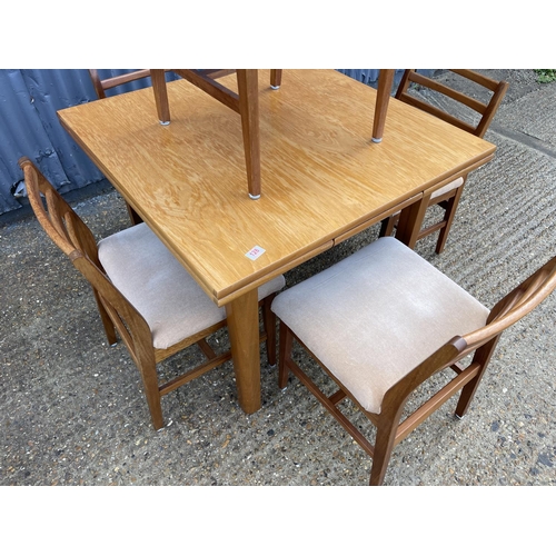 128 - A danish style teak drawer leaf table with five chairs stamped A&FH