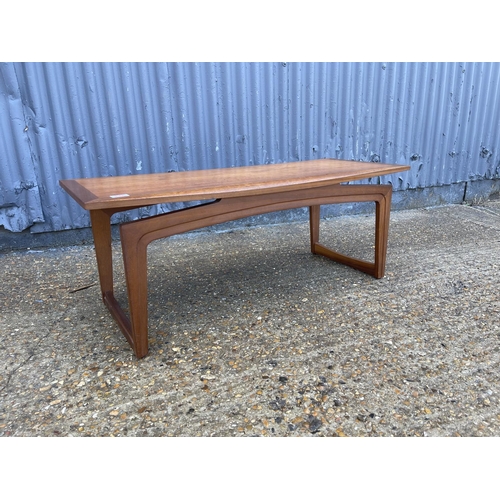 131 - A teak nest of three together with a g plan tile top table