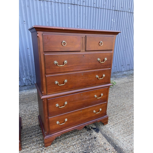 134 - A hardwood tallboy chest of drawers stamped MADE IN USA 95x40x146