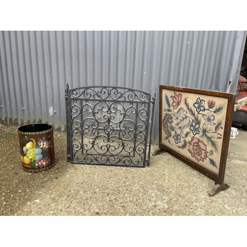 14 - An iron folding fire guard together with tapestry screen and painted bin