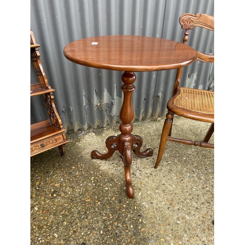 15 - A mahogany occasional table, wall shelf, begere chair and two oval occasional tables