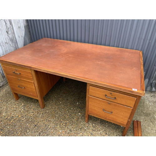 167 - A large twin pedestal oak office desk