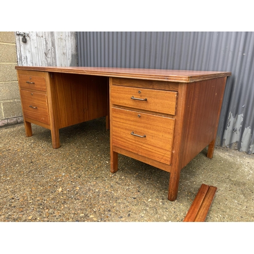 167 - A large twin pedestal oak office desk