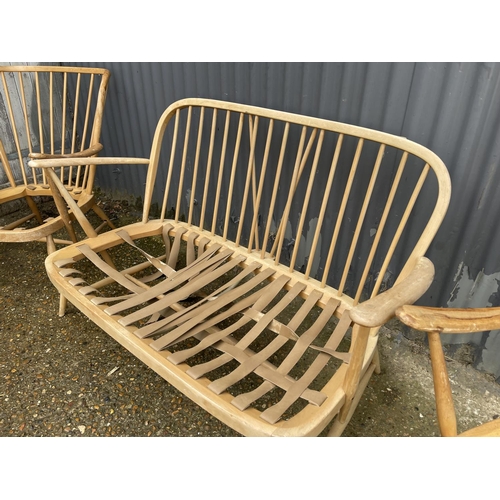 169 - An ercol light elm three piece suite for repair and restoration