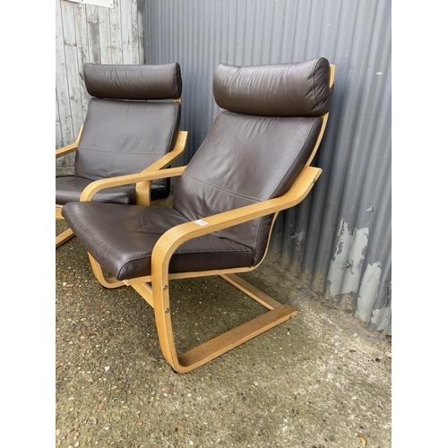 172 - A pair of modern cantilever armchairs with brown leather upholstery