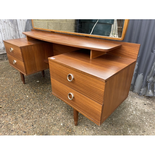 176 - A mid century teak four drawer dressing chest