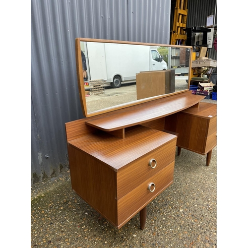 176 - A mid century teak four drawer dressing chest