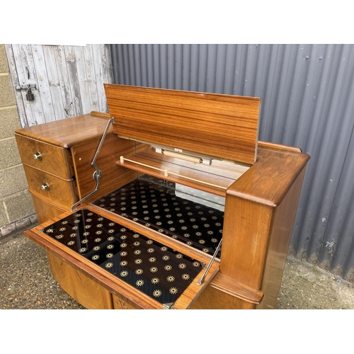 177 - A deco style walnut cocktail sideboard with mirror glass interior