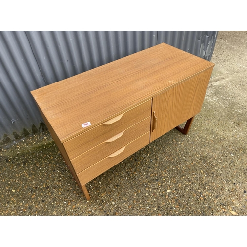 180 - A compact teak effect three drawer sideboard