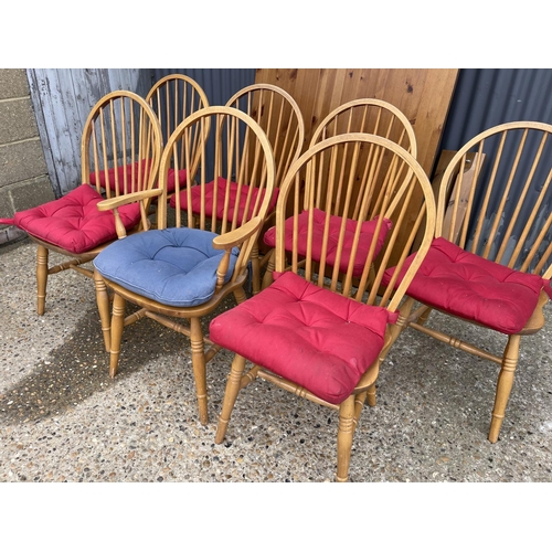 19 - A modern pine rectangular dining table together with seven stick back pine dining chairs 100x180