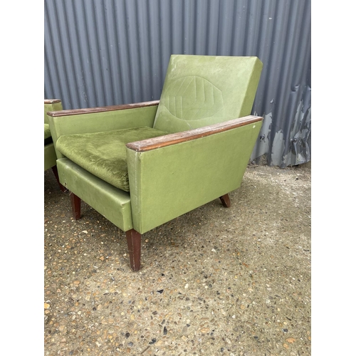 197 - A pair of deco style green upholstered armchairs