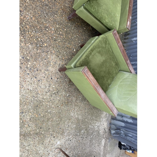 197 - A pair of deco style green upholstered armchairs