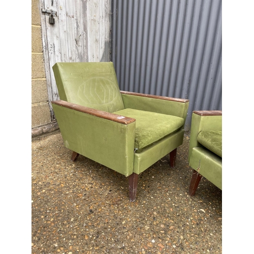 197 - A pair of deco style green upholstered armchairs