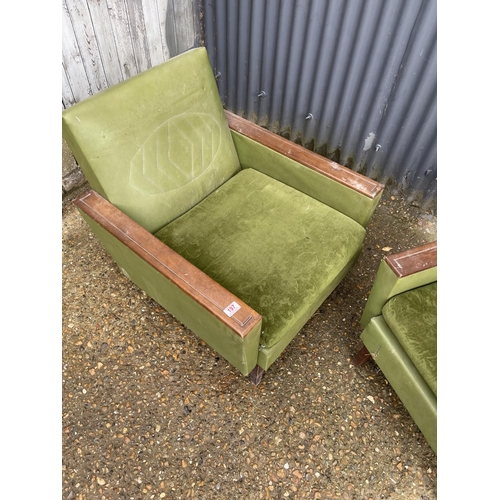 197 - A pair of deco style green upholstered armchairs