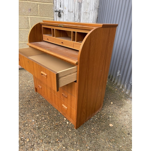 202 - A mid century danish style teak cylinder front bureau