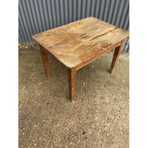 203 - A rustic pine kitchen table with drawer