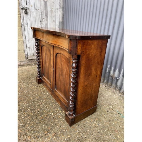 204 - A victorian mahogany serpentine front sideboard