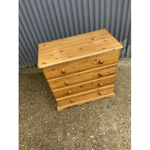 206 - A modern pine chest of four drawers