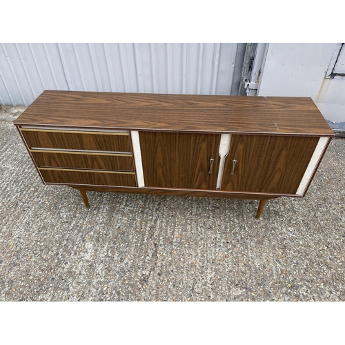 208 - A mid century formica sideboard